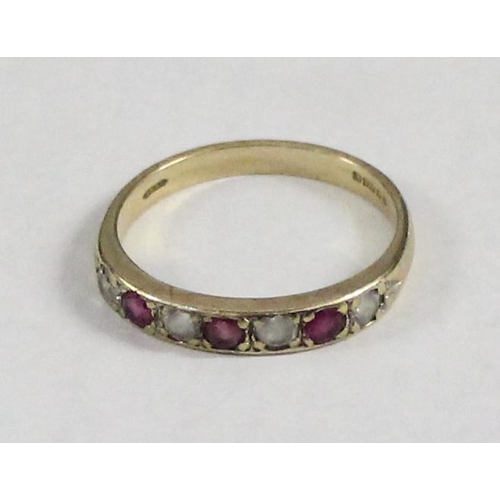 1203 - 9ct gold half eternity ring set with pink & white stones, approx size M & 1.78g gross