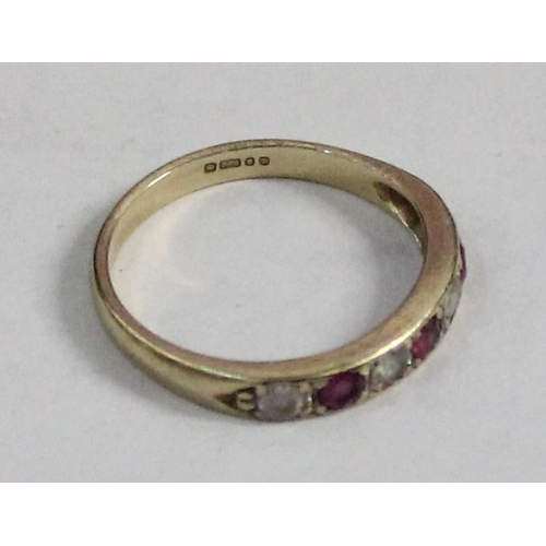 1203 - 9ct gold half eternity ring set with pink & white stones, approx size M & 1.78g gross