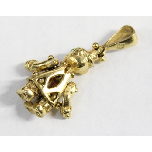 1205 - 9ct gold charm formed as a clown, set with green & pink stones, articulated arms and legs, approx 3.... 