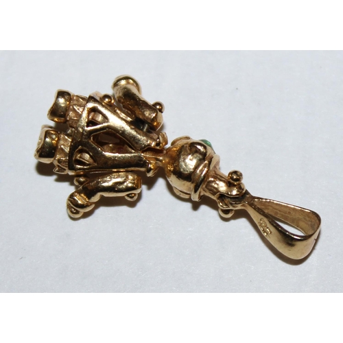 1205 - 9ct gold charm formed as a clown, set with green & pink stones, articulated arms and legs, approx 3.... 