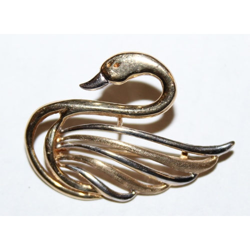 1209 - A 9ct gold brooch formed as a swan, yellow and white gold mix, approx 2.11g gross weight