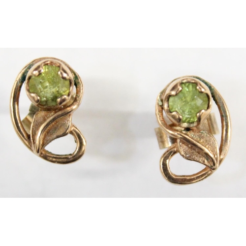 1212 - A pair of 9ct gold earrings in the Art Nouveau style, leaf design with green set stone, both earring... 