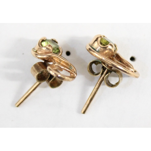 1212 - A pair of 9ct gold earrings in the Art Nouveau style, leaf design with green set stone, both earring... 