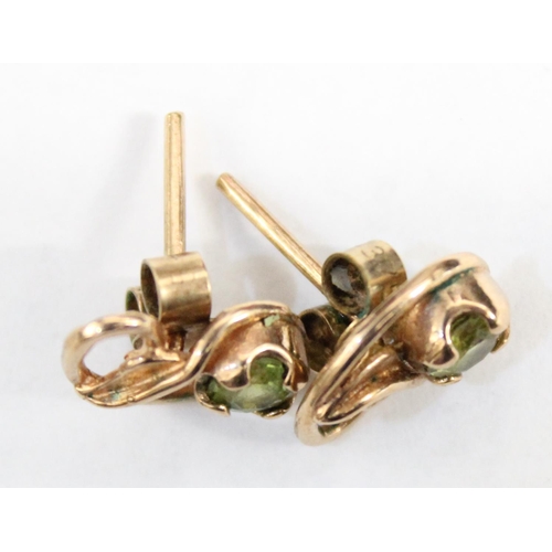 1212 - A pair of 9ct gold earrings in the Art Nouveau style, leaf design with green set stone, both earring... 