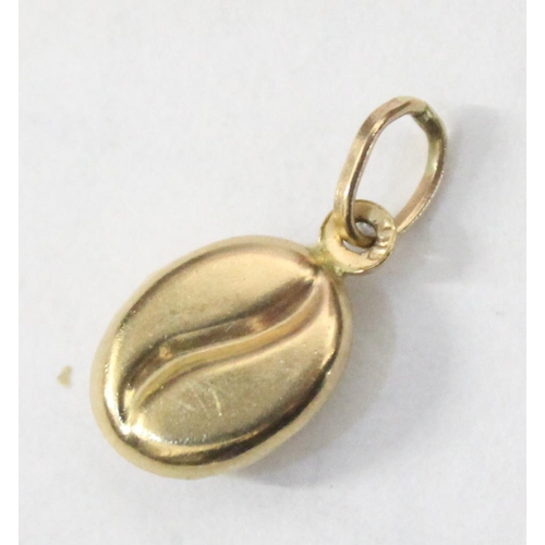 1214 - 9ct gold charm formed as a coffee bean, approx 0.38g gross weight