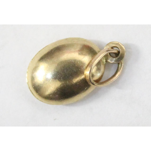 1214 - 9ct gold charm formed as a coffee bean, approx 0.38g gross weight