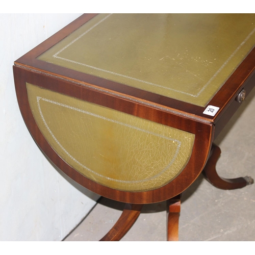 20 - An antique style leather topped dropleaf sofa table