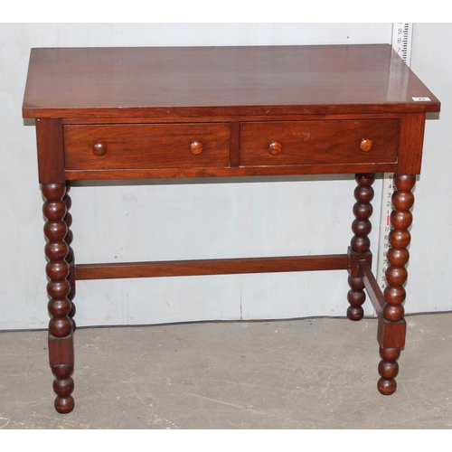 23 - A 20th century 2 drawer hall table with bobbin turned legs