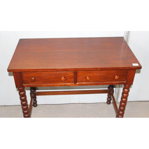 23 - A 20th century 2 drawer hall table with bobbin turned legs