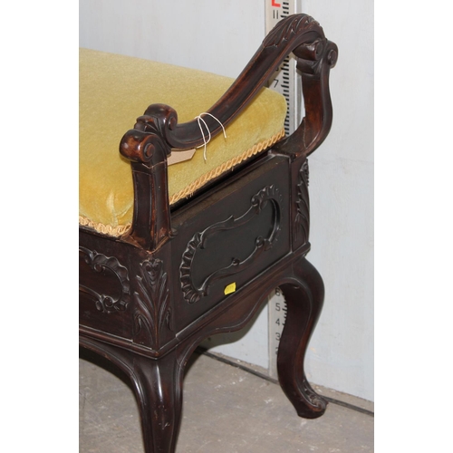 26 - A Victorian carved mahogany duet piano stool in the Art Nouveau taste and gold coloured upholstery