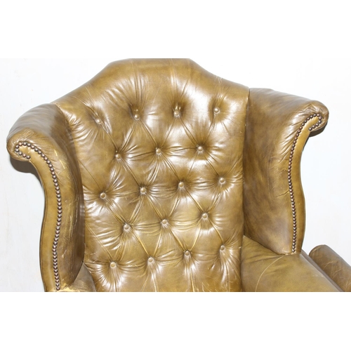 31 - Chesterfield button back armchair in green colour on cabriole legs