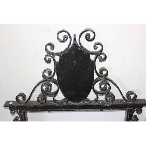 323 - A large wrought iron hanging pub sign bracket, likely early 20th century