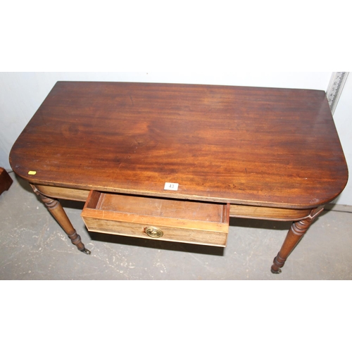 43 - Victorian mahogany D shaped hall table with drawer on brass castors