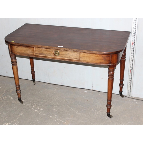 43 - Victorian mahogany D shaped hall table with drawer on brass castors