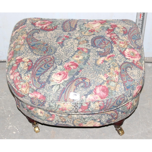 49 - An antique style footstool with Art Nouveau inspired fabric and turned wooden legs with brass cup ca... 