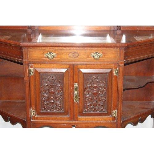 51 - Edwardian mirrored chiffonier with heavily carved panels and doors and a single drawer. Fret work de... 