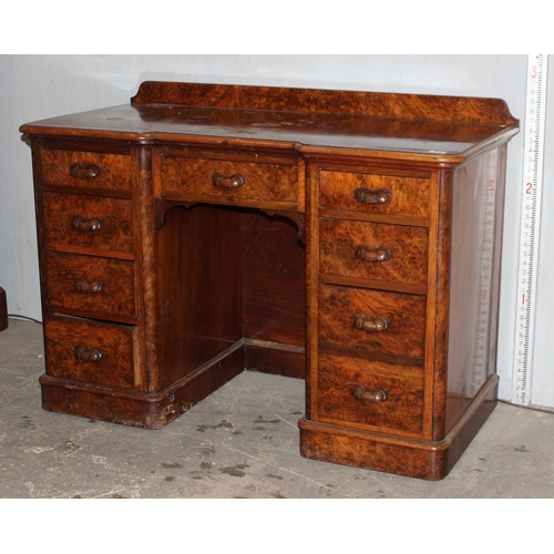 61 - Antique walnut veneered nine drawer desk