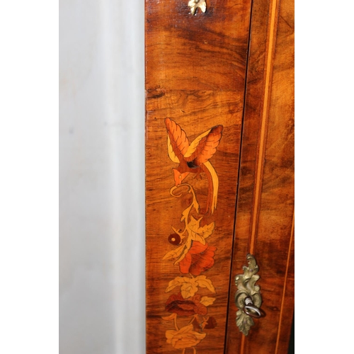 75 - An antique marquetry inlaid pier cabinet with gilt metal mounts and key, 19th century