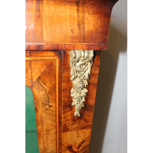 75 - An antique marquetry inlaid pier cabinet with gilt metal mounts and key, 19th century