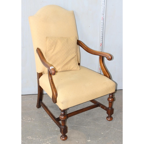 8 - A Georgian style high backed armchair with yellow upholstery