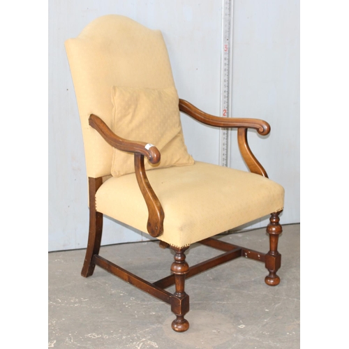 8 - A Georgian style high backed armchair with yellow upholstery