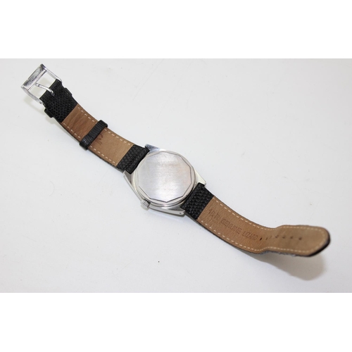 1402 - A vintage Tissot PR516 manual wind wristwatch with blue dial, replacement leather strap