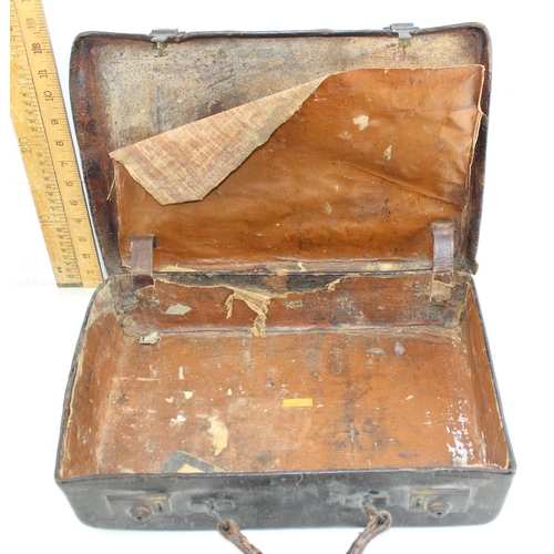 277 - An antique Mahogany brass cornered writing slope, lacking interior and an old small leather suitcase