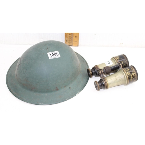 1006 - A WW2 period Brodie helmet, lacking liner and a pair of early 20th century binoculars