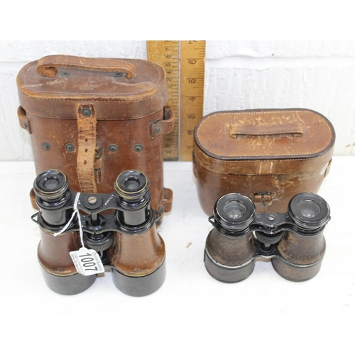 1007 - A pair of WW1 period military binoculars by Tubeue of Paris in leather case and another pair of earl... 