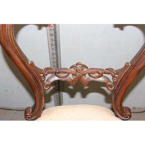 132 - Two antique carved mahogany balloon back dining chairs