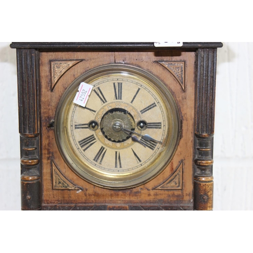 1408 - An early 20th century HAC German made wooden cased mantle clock, with key and pendulum