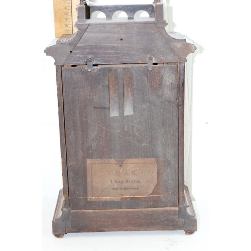 1408 - An early 20th century HAC German made wooden cased mantle clock, with key and pendulum