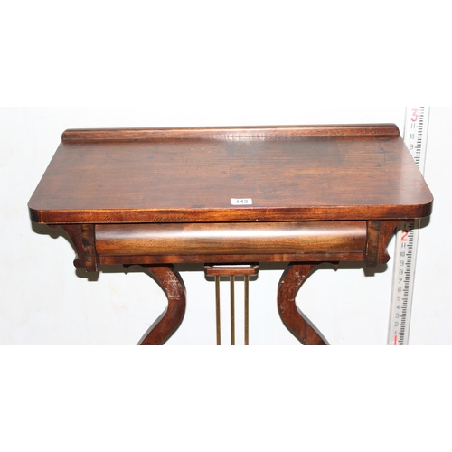 142 - A Biedermeier style antique side table with drawer formed as a lyre, possibly of Swedish origin, bel... 