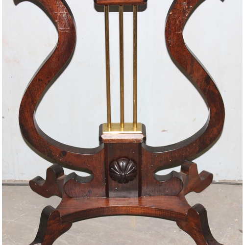 142 - A Biedermeier style antique side table with drawer formed as a lyre, possibly of Swedish origin, bel... 