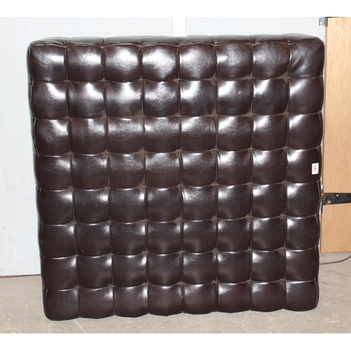 145 - A large black leather effect Chesterfield type footstool, approx 100cm square