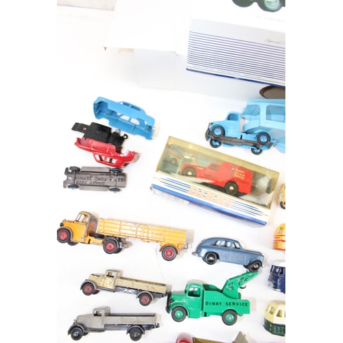 1509 - A large qty of assorted vintage and later Dinky toy vehicles, some boxed,