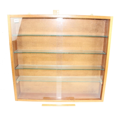 1511 - A wall mounted toy car display cabinet