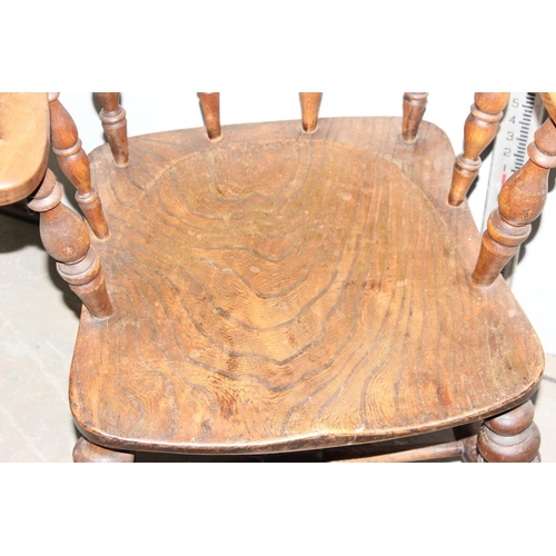 156 - An early 20th century smoker's bow or captain's armchair with elm seat