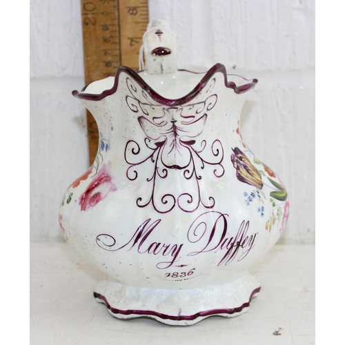 1613 - An early 19th century large porcelain jug decorated with superb quality floral sprays, named Mary Du... 