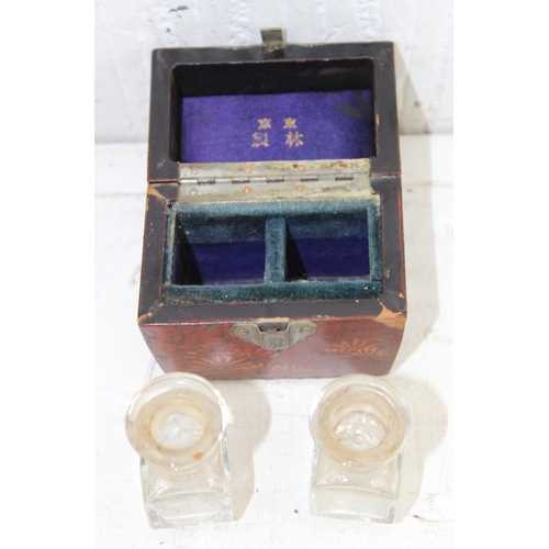 1618 - An early 20th century Japanese lacquered travelling inkwell and a vintage decorated wooden card case