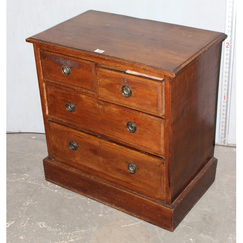 165 - Edwardian oak two over two chest of drawers with iron work handles