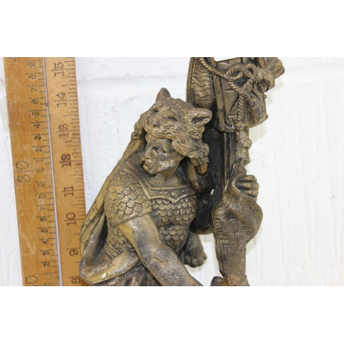 239 - An antique classical style gilded spelter lamp formed as a Roman soldier mearing wolf skin headdress