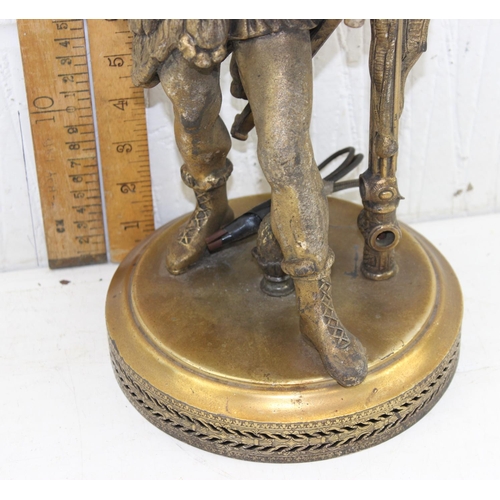 239 - An antique classical style gilded spelter lamp formed as a Roman soldier mearing wolf skin headdress