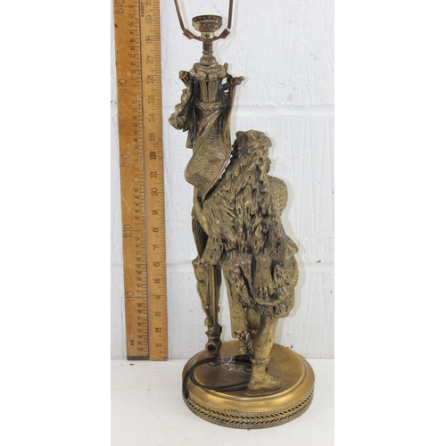 239 - An antique classical style gilded spelter lamp formed as a Roman soldier mearing wolf skin headdress