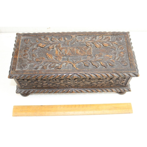 276 - An antique brass bound Mahogany writing slope and a carved oak box named 