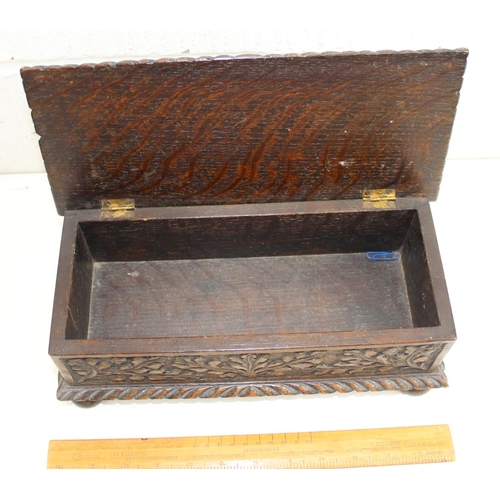 276 - An antique brass bound Mahogany writing slope and a carved oak box named 