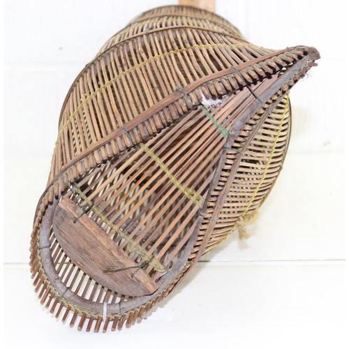 750 - A large vintage wicker basket believed to be an Eel trap