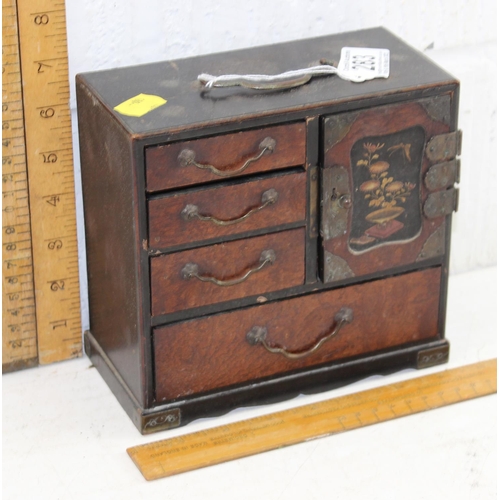 283 - An early 20th century Japanese lacquer table top miniature cabinet with gilt decoration