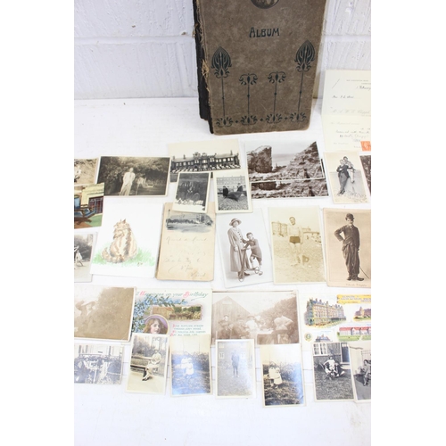 579 - Antique postcard album with contents, some photographs and various other ephemera - This lot is bein... 