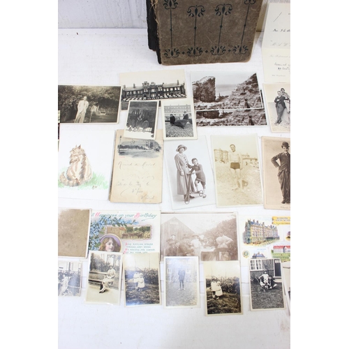 579 - Antique postcard album with contents, some photographs and various other ephemera - This lot is bein... 